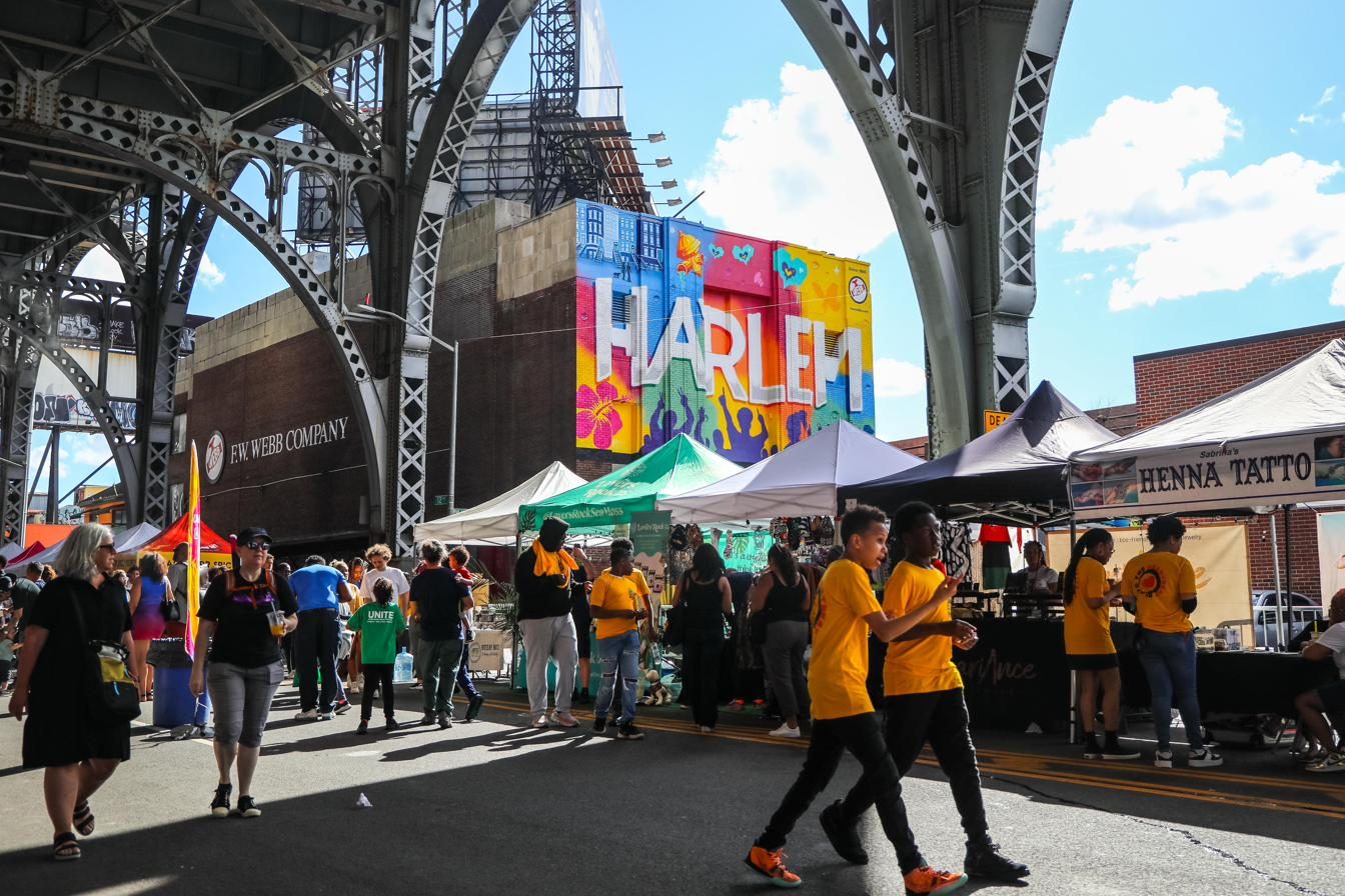 Vendor row under the Harlem arches